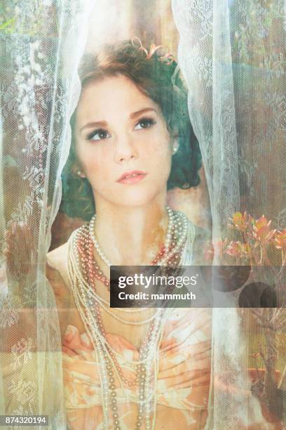 retro woman behind lace curtain - vintage lace curtains stock pictures, royalty-free photos & images