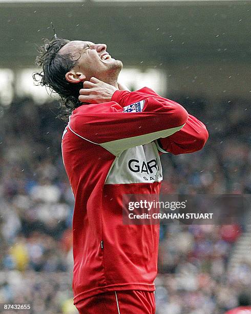 Middlesbrough's Turkish striker Tuncay Sanli shows his disappointment after missing a good chance during the English Premier League football match...