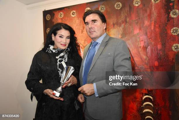 La Femme dans Le Siecle' awarded Lamia Khashoggi poses with Alexandre J. Schwab from Ç Association La Femme Dans Le Sicle È during 'La Femme dans Le...