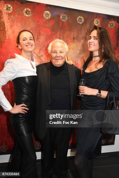 Fashiondesigner Olga Boyarinova, Massimo Gargia and Helena Khoi pose with works of Chayan Khoi during 'La Femme dans Le Siecle' Exhibition and Award...