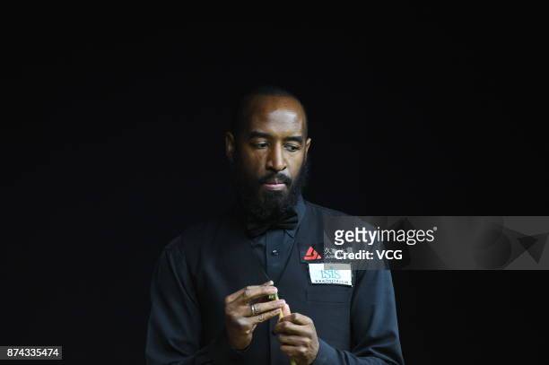 Rory McLeod of England chalks the cue during the first round match against Stephen Maguire of Scotland on day two of 2017 Shanghai Masters at...
