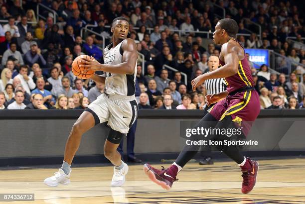 Providence Friars guard Alpha Diallo defended by Minnesota Golden Gophers guard Isaiah Washington during a college basketball game between Minnesota...