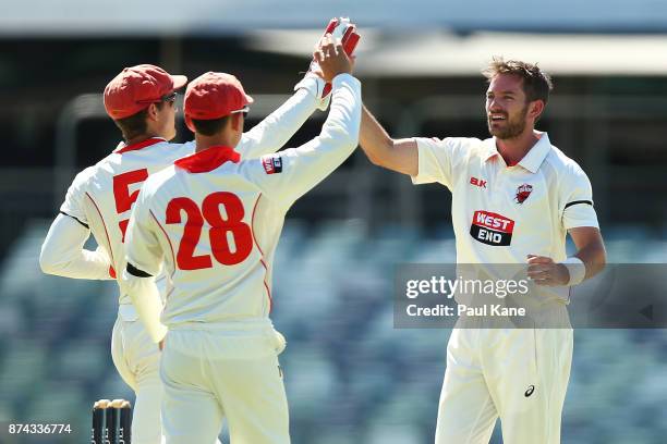 Alex Carey, Jake Weatherald and Chadd Sayers of South Australia celebrate the wicket of Ashton Turner of Western Australia during day three of the...