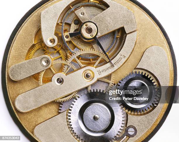 internal mechanism of a watch close up - uhrwerk stock-fotos und bilder