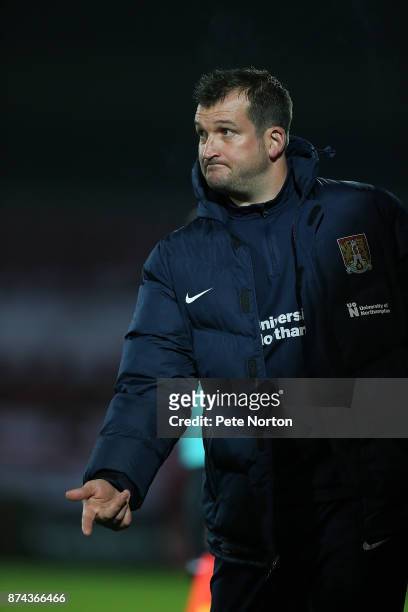 Northampton Town coach Jim Hollman gives instructions during the Emirates FA Cup First Round Replay match between Scunthorpe United and Northampton...