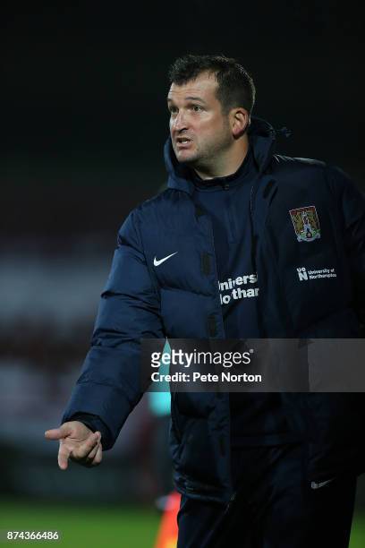 Northampton Town coach Jim Hollman gives instructions during the Emirates FA Cup First Round Replay match between Scunthorpe United and Northampton...