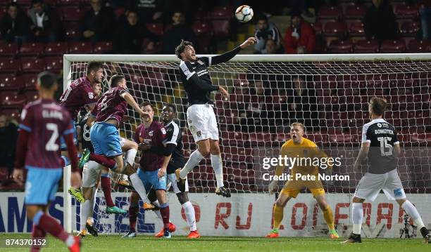 Matt Crooks of Northampton Town rises to head the ball during the Emirates FA Cup First Round Replay match between Scunthorpe United and Northampton...