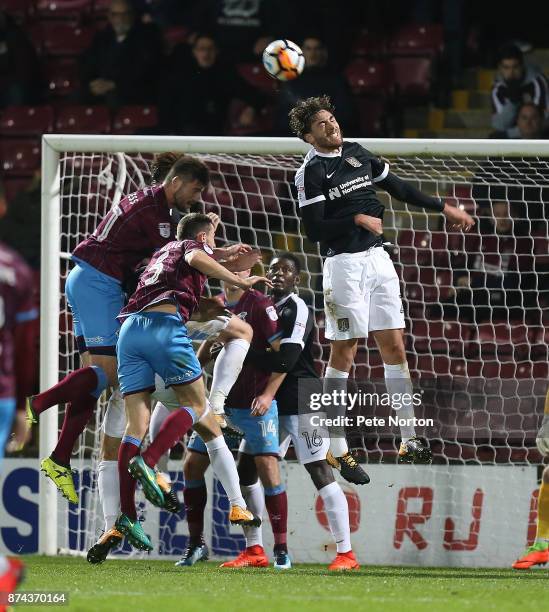 Matt Crooks of Northampton Town rises to head the ball during the Emirates FA Cup First Round Replay match between Scunthorpe United and Northampton...