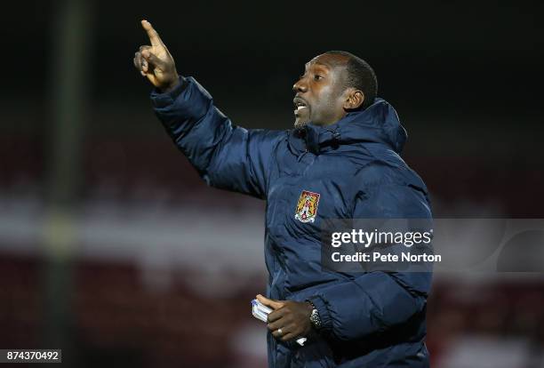 Northampton Town manager Jimmy Floyd Hasselbaink gives instuctions during the Emirates FA Cup First Round Replay match between Scunthorpe United and...