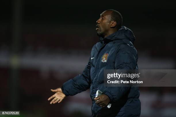 Northampton Town manager Jimmy Floyd Hasselbaink gives instuctions during the Emirates FA Cup First Round Replay match between Scunthorpe United and...