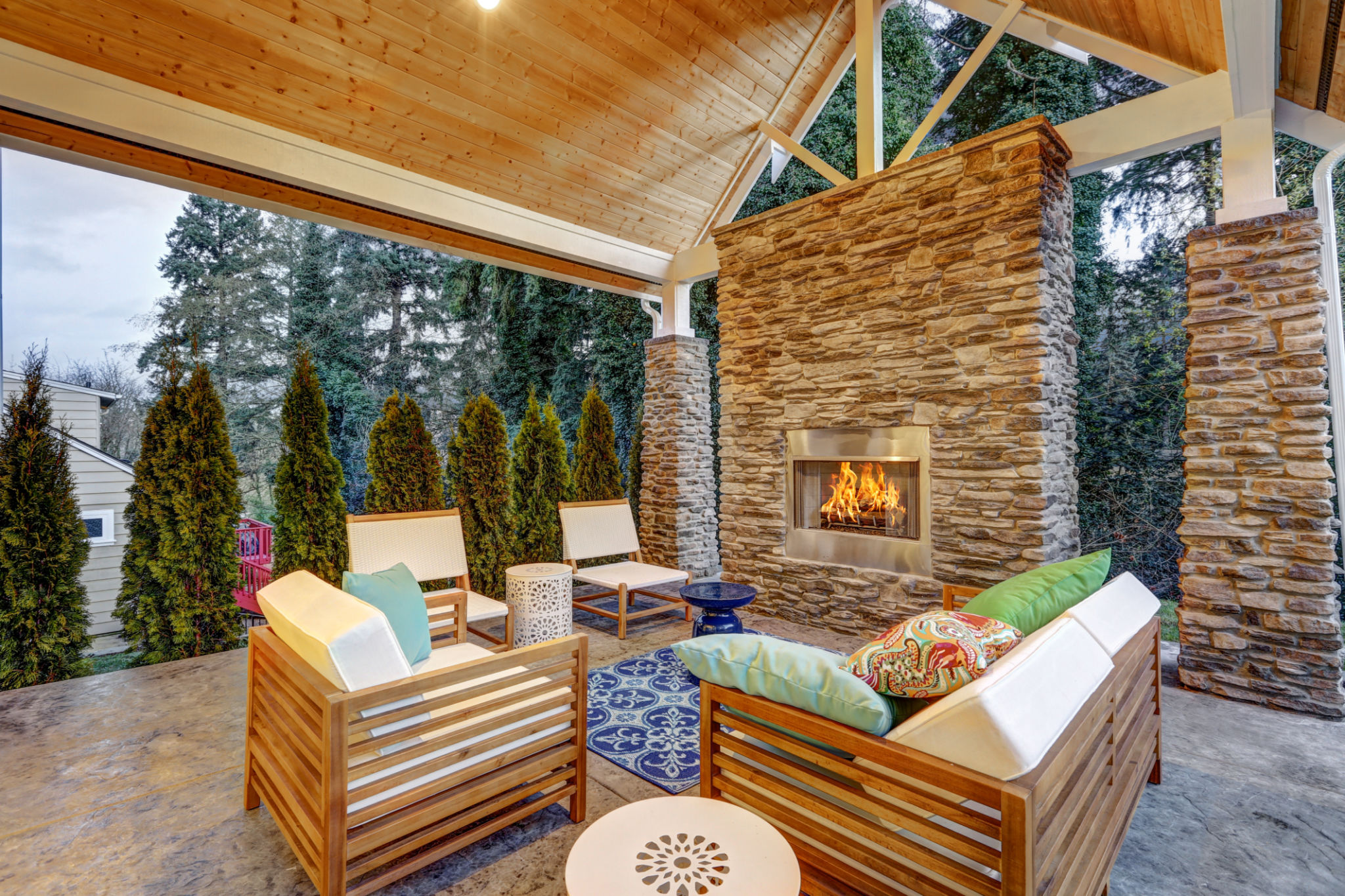 Chic covered back patio with built in gas fireplace Chic covered back patio with built in gas fireplace