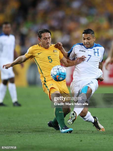 Mark Milligan of Australia and Emilio Izaguirre of Honduras compete during the 2018 FIFA World Cup Qualifiers Leg 2 match between the Australian...