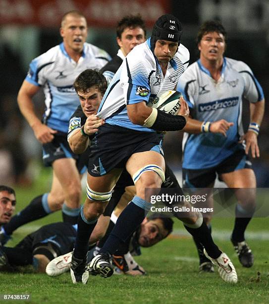 Pierre Spies on the charge as Keegan Daniel makes a challenge during the Super 14 match between the Sharks and Vodacom Bulls from Absa Stadium on May...