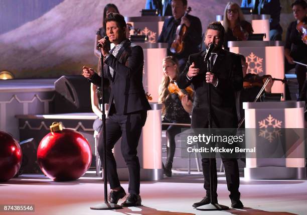 Recording artists Dan Smyer and Shay Mooney of Dan + Shay perform during CMA 2017 Country Christmas at The Grand Ole Opry on November 14, 2017 in...