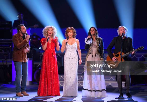 Recording artist Reba McEntire performs with Jimi Westbrook, Kimberly Schlapman, Karen Fairchild and Philip Sweet during CMA 2017 Country Christmas...