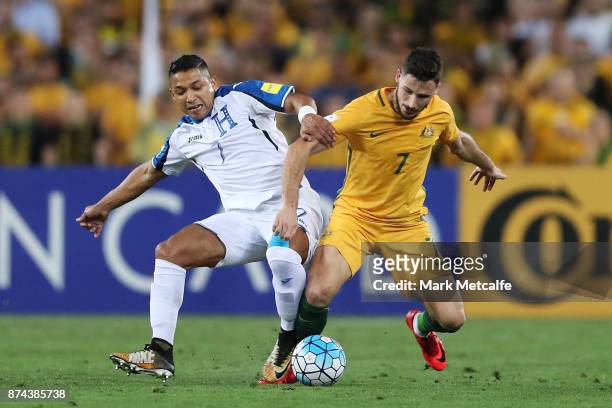 Mathew Leckie of Australia and Emilio Izaguirre of Honduras compete during the 2018 FIFA World Cup Qualifiers Leg 2 match between the Australian...