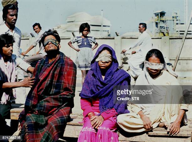 Victims who lost sight after the Bhopal tragedy are seen on December 04, 1984 in Bhopal where a poison gas leak from the Union Carbide factory killed...