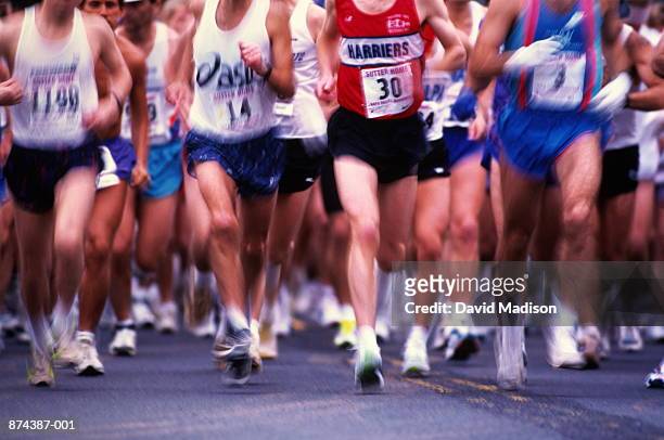 marathon runners in action, low angle view - pettorina foto e immagini stock