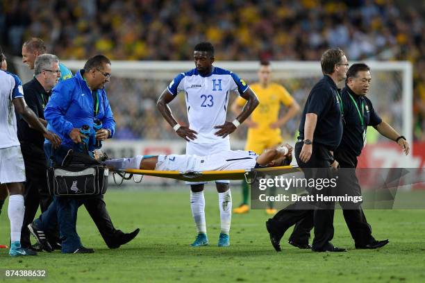 Emilio Izaguirre of Honduras is assisted from the field during the 2018 FIFA World Cup Qualifiers Leg 2 match between the Australian Socceroos and...