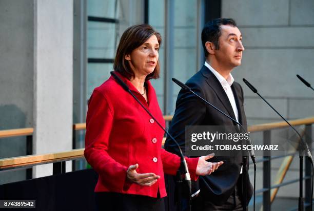 Co-leader of the Greens Cem Oezdemir and parliamentary group co-leader Katrin Goering-Eckardt address journalists prior to further exploratory talks...