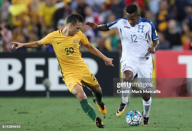 Romell Quioto of Honduras is challenged by Trent Sainsbury of Australia during the 2018 FIFA World Cup Qualifiers Leg 2 match between the Australian...