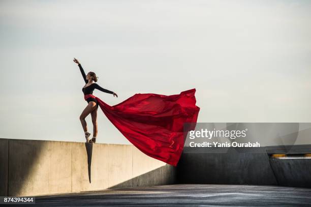 female dancer dancing in the streets of lyon, france - urban ballet stockfoto's en -beelden