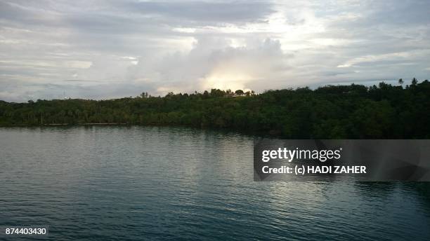 sunrise over the house on manus island - manus island regional processing centre stock pictures, royalty-free photos & images
