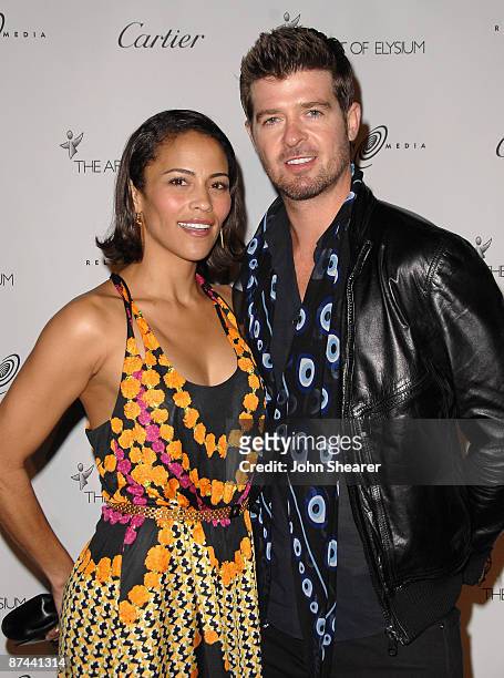 Actress Paula Patton and musician Robin Thicke arrives at The Art of Elysium's first annual PARADIS with Cartier and Relativity Media at the Soho...