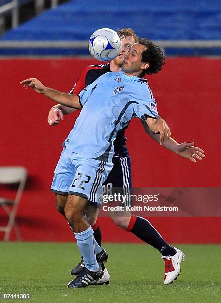 Nick LaBrocca of the Colorado Rapids heads the ball in front of Pat Phelan of the New England Revolution May 16, 2009 at Gillette Stadium in...