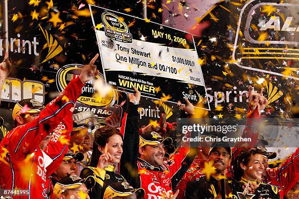 Tony Stewart, driver of the Office Depot Chevrolet, celebrates in victory lane after winning the NASCAR Sprint All-Star Race on May 16, 2009 at...