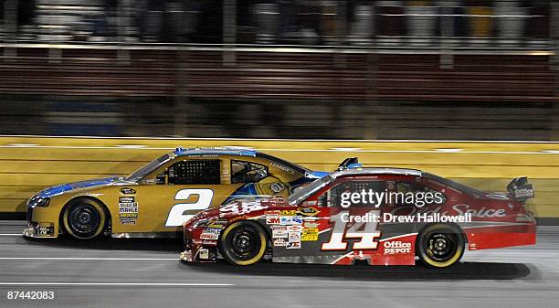Tony Stewart, driver of the Office Depot Chevrolet, races Kurt Busch, driver of the Miller Lite Dodge, during the NASCAR Sprint All-Star Race on May...