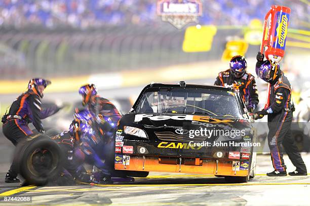 Denny Hamlin driver of the FedEx Toyota makes a pit stop during the NASCAR Sprint All-Star Race on May 16, 2009 at Lowe's Motor Speedway in Concord,...