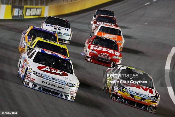 Bobby Labonte, driver of the Ask.com Ford leads a pack of cars during the NASCAR Sprint All-Star Race on May 16, 2009 at Lowe's Motor Speedway in...