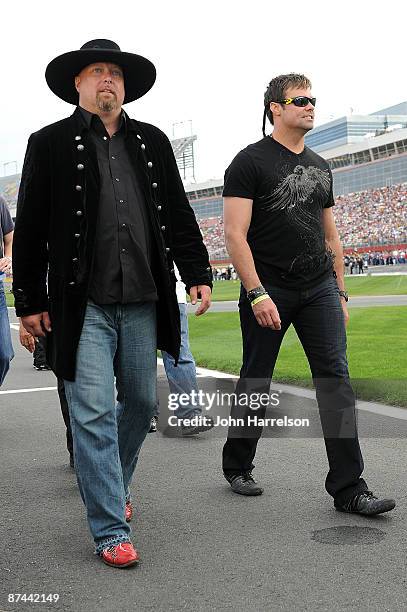 Eddie Montgomery and Troy Gentry of Montgomery Gentry walk down pit road before the start of the NASCAR Sprint All-Star Race on May 16, 2009 at...