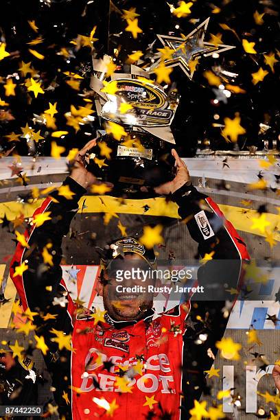Tony Stewart, driver of the Office Depot Chevrolet, celebrates in victory lane after winning the NASCAR Sprint All-Star Race on May 16, 2009 at...