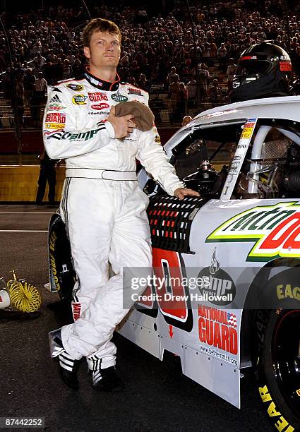 Dale Earnhardt Jr., driver of the Dale Jr. Foundation Chevrolet observes the National Anthem during the NASCAR Sprint All-Star Race on May 16, 2009...