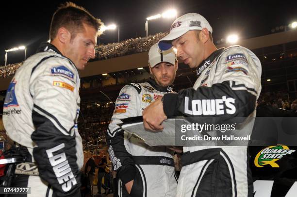 Jimmie Johnson, driver of the Lowe's-Kobalt Tools Chevrolet, talks with his crew before the NASCAR Sprint All-Star Race on May 16, 2009 at Lowe's...