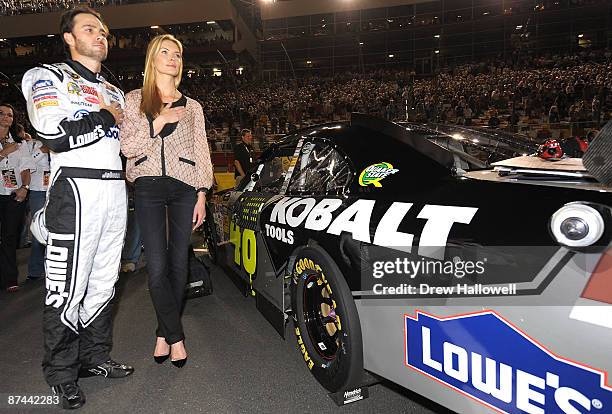 Jimmie Johnson, driver of the Lowe's-Kobalt Tools Chevrolet and his wife Chandra, observe the National Anthem during the NASCAR Sprint All-Star Race...