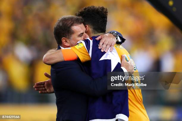 Australia Coach Ange Postecoglou and Mile Jedinak of Australia celebrate victory during the 2018 FIFA World Cup Qualifiers Leg 2 match between the...