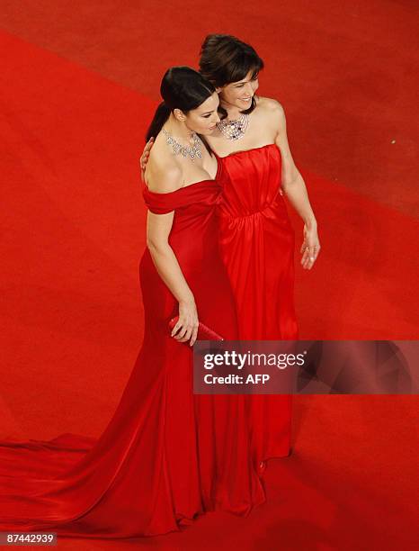 Italian actress Monica Bellucci and French actress Sophie Marceau pose while arriving for the screening of the movie "Ne Te Retourne Pas" out of...