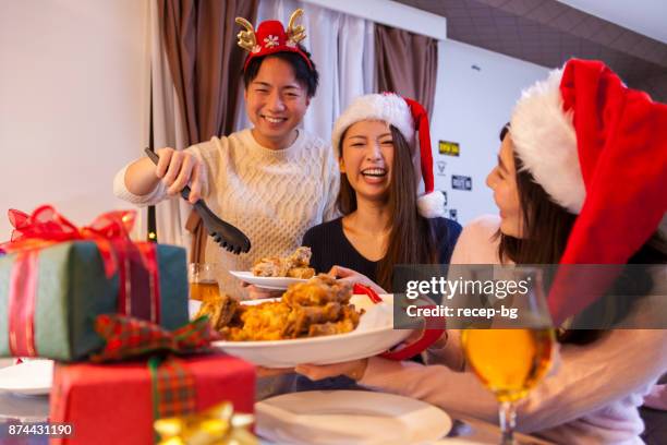 friends enjoying christmas - chicken decoration stock pictures, royalty-free photos & images