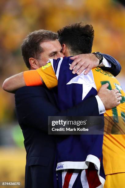 Australia Coach Ange Postecoglou and Mile Jedinak of Australia celebrate victory during the 2018 FIFA World Cup Qualifiers Leg 2 match between the...