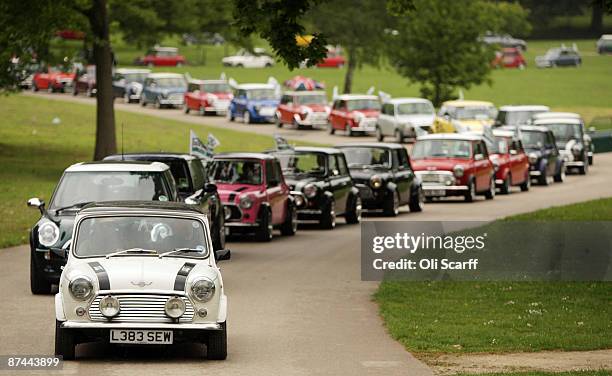 Mini owners celebrating the 50th anniversary of the car drive through Crystal Palace Park at the start of the annual "London To Brighton Mini Run" on...