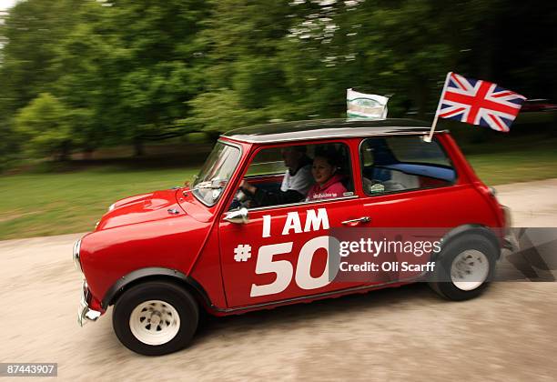Mini owners celebrating the 50th anniversary of the car drive through Crystal Palace Park at the start of the annual "London to Brighton Mini Run" on...
