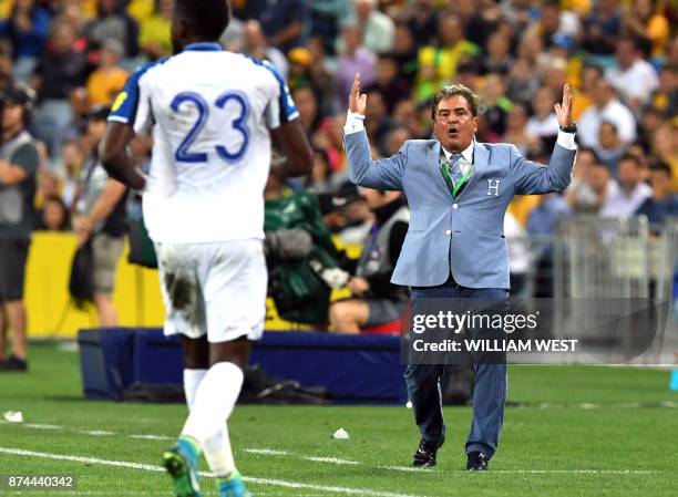 Honduras' coach Jorge Luis Pinto gestures at player Johnny Palacios during their 2018 World Cup qualification play-off football match against...