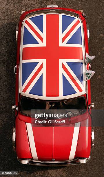 Mini owners celebrating the 50th anniversary of the car drive through Crystal Palace Park at the start of the annual "London to Brighton Mini Run" on...