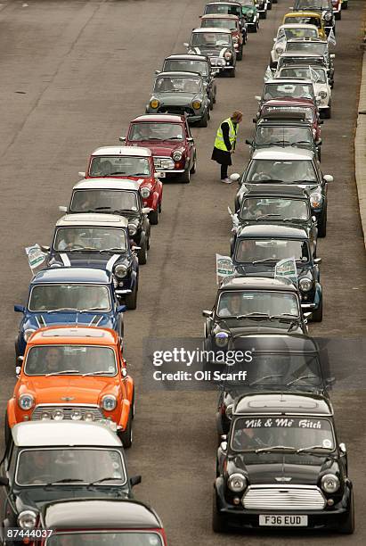 Mini owners celebrating the 50th anniversary of the car drive through Crystal Palace Park at the start of the annual "London to Brighton Mini Run" on...