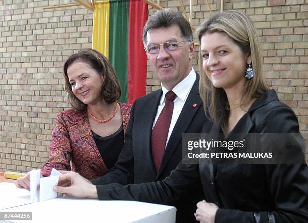 Lithuania's presidential candidate Algirdas Butkevicius poses with his wife Janina and daughter Indre during the first round of presidential election...