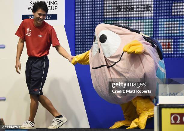 The event mascot is seen deflating during the victory ceremony on day two of the FINA Swimming World Cup at Tokyo Tatsumi International Swimming...