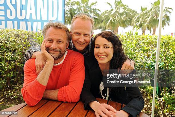 Actors Michael Nyqvist and Noomi Rapace and director Niels Arden Oplev pose during the "The Girl With the Dragon Tattoo" photo call at the...